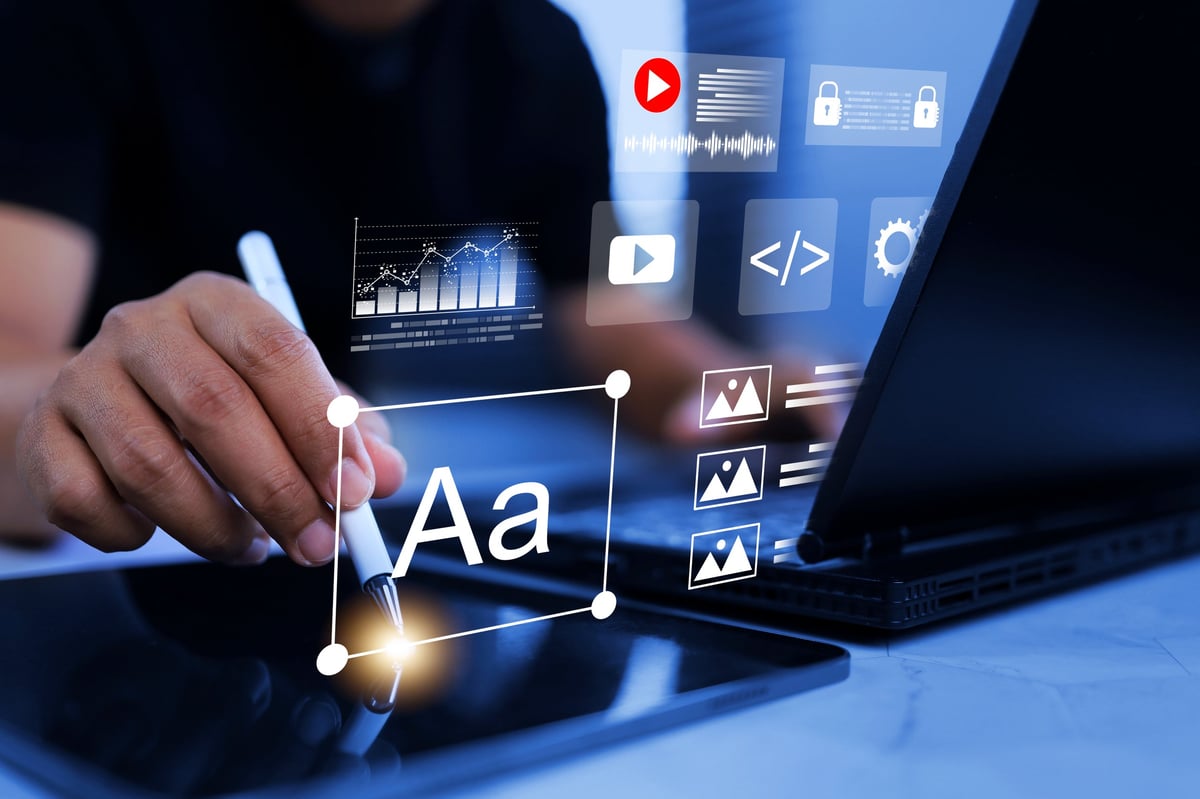 Designer building a website layout on a tablet, refining page structure and interface elements